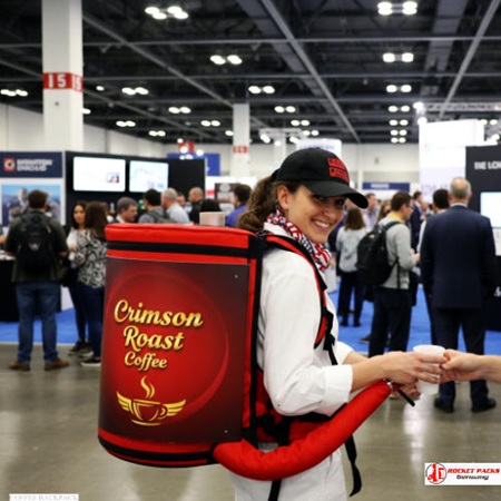 Coffee Hawker Backpack serving flat white coffee in Rome during roadshow event, enhancing visual merchandising and product presentation to stimulate shopper interest and brand engagement.