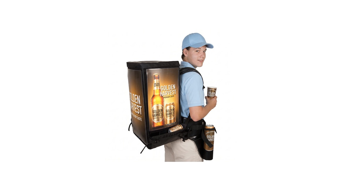 Promoter in action, flexibly serving fresh hot coffee directly to clients with a mobile coffee backpack.