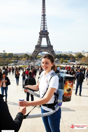 Mobile Coffee Vendor Backpack dispensing Americano in Vienna at wine festival, live tasting event with brand activation, customer interaction, and impactful POS trend marketing.